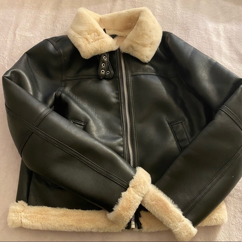Leather, fur jacket. Very cozy and warm.